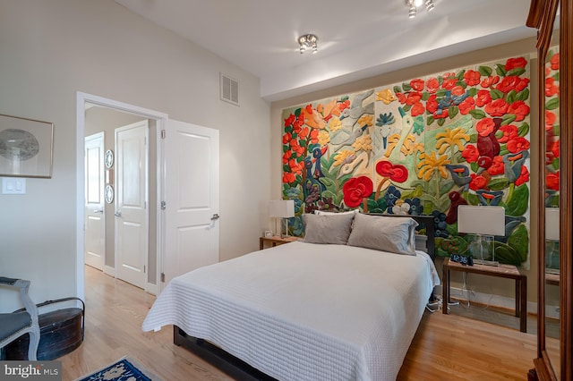 bedroom with wood-type flooring