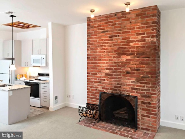 interior space with a brick fireplace and light colored carpet