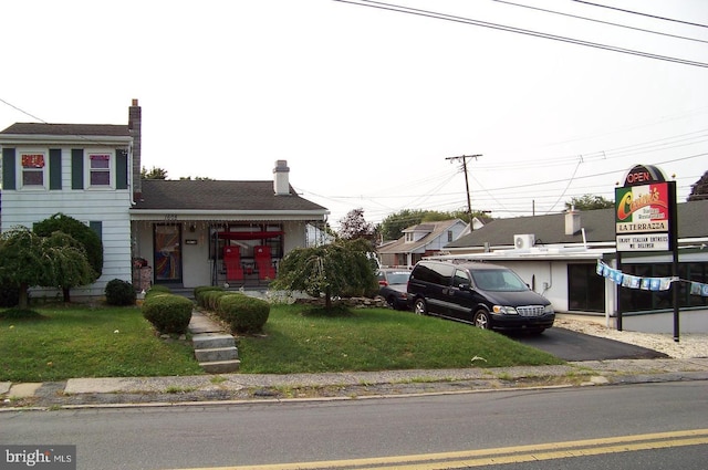 view of front of home with a front yard