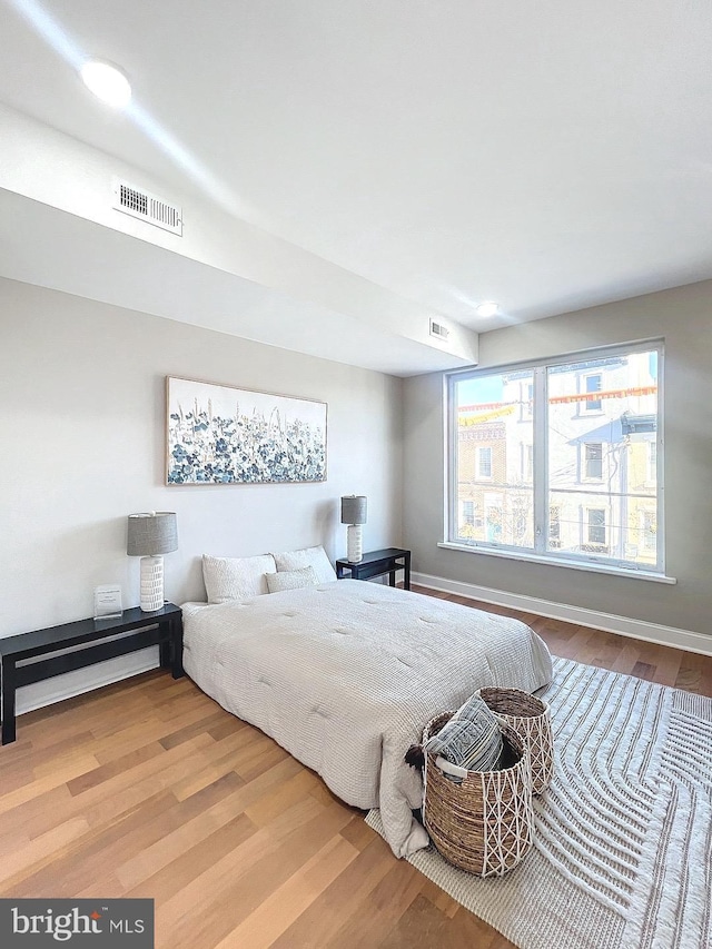 bedroom with light hardwood / wood-style flooring