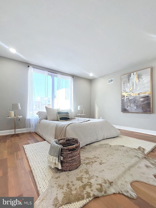 unfurnished bedroom with wood-type flooring