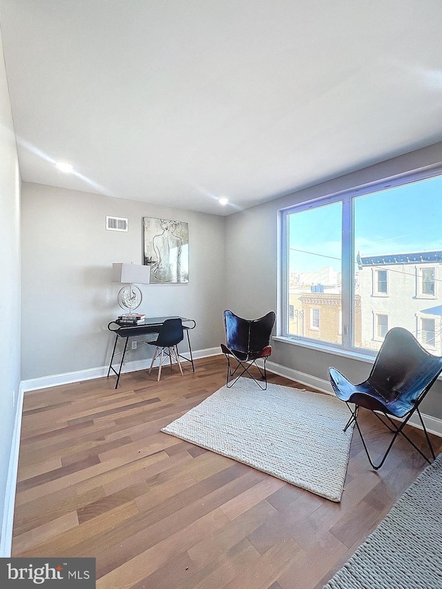 living area featuring hardwood / wood-style floors