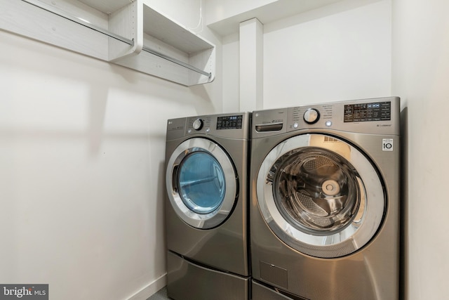 laundry area with laundry area and separate washer and dryer