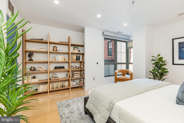 bedroom featuring recessed lighting and light wood finished floors