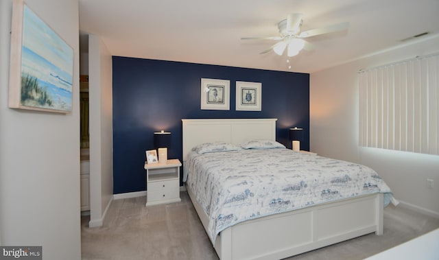 bedroom with ceiling fan and light colored carpet