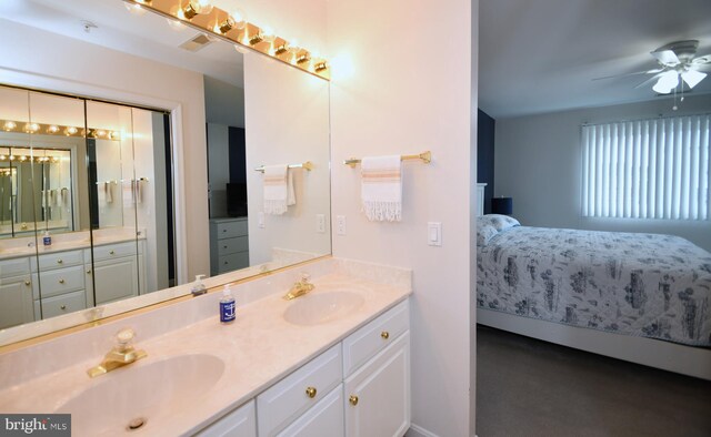 bathroom featuring ceiling fan and vanity