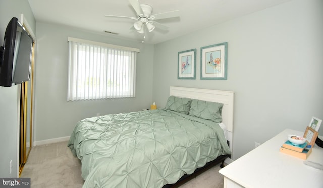 bedroom featuring ceiling fan and light colored carpet