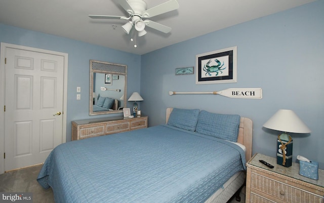 bedroom with ceiling fan and carpet flooring