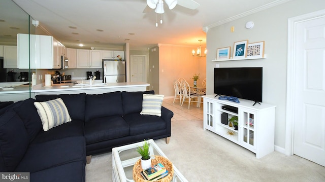 carpeted living room with ceiling fan with notable chandelier and crown molding