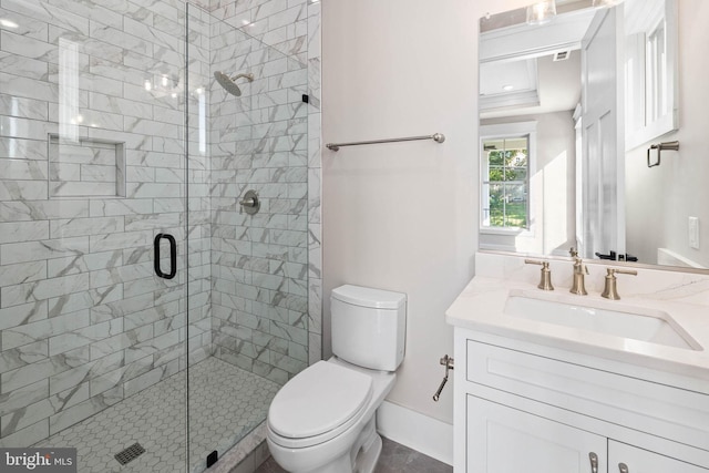 bathroom featuring a shower with door, vanity, and toilet