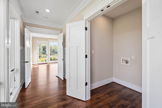 hall featuring dark hardwood / wood-style floors and crown molding