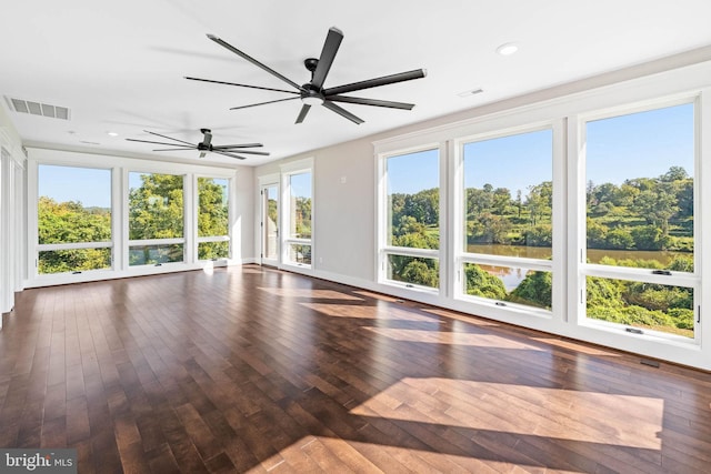 interior space with ceiling fan