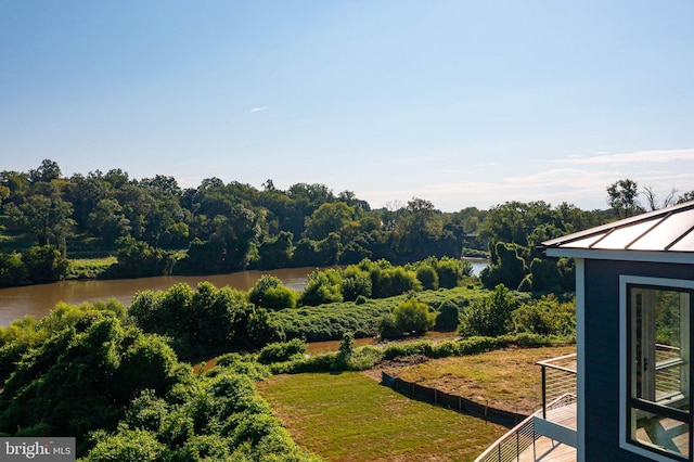 view of yard with a balcony and a water view