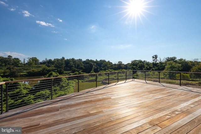 wooden deck with a rural view