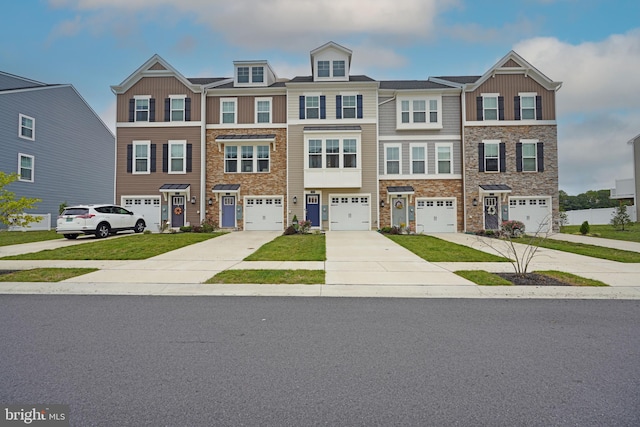 townhome / multi-family property featuring a garage