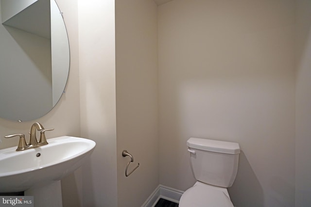 bathroom with sink and toilet