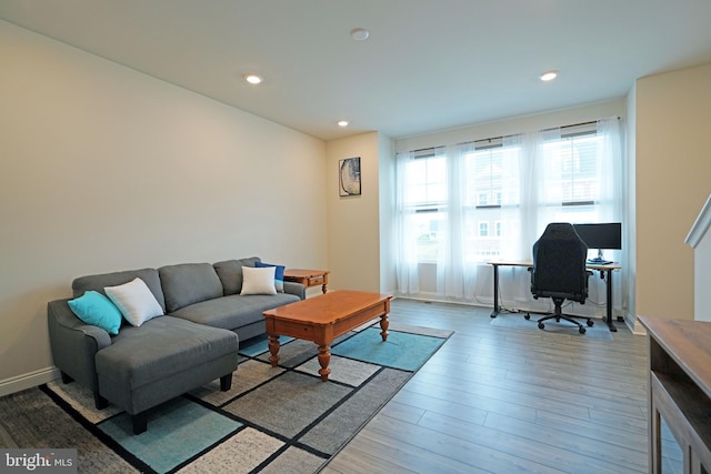 living room with light hardwood / wood-style flooring