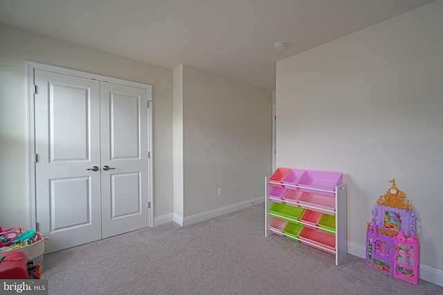 playroom featuring light colored carpet