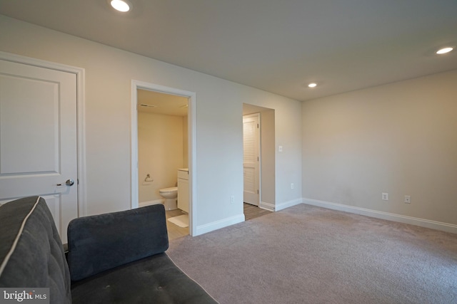 living area featuring light colored carpet