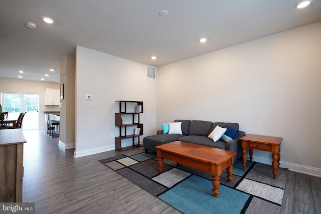 living room featuring dark hardwood / wood-style floors