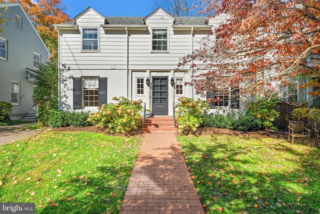 view of front of property with a front lawn