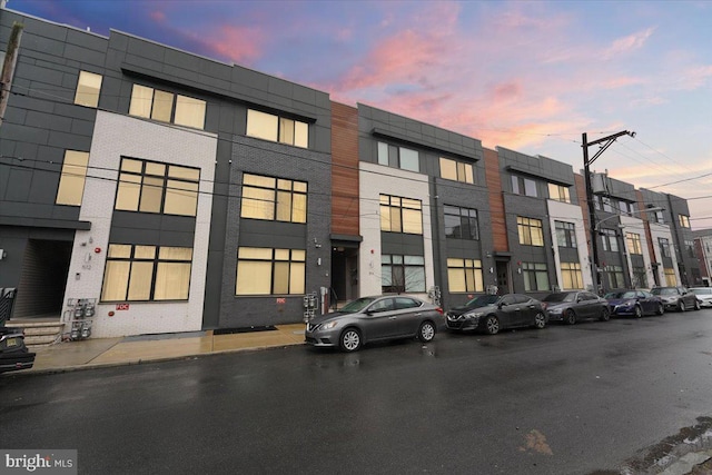 view of outdoor building at dusk