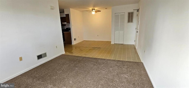 unfurnished room featuring carpet flooring and ceiling fan