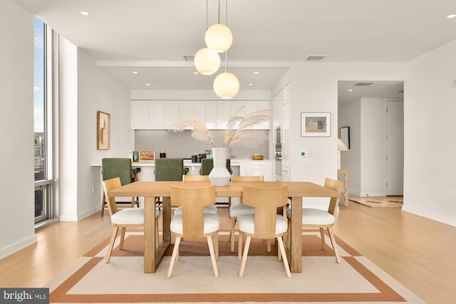 dining room featuring light hardwood / wood-style floors