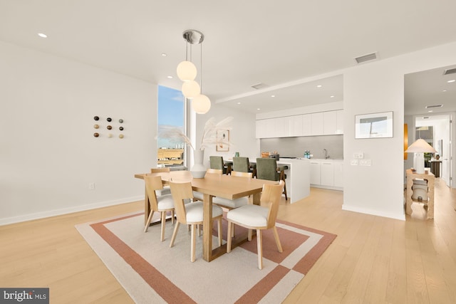 dining area with light hardwood / wood-style flooring