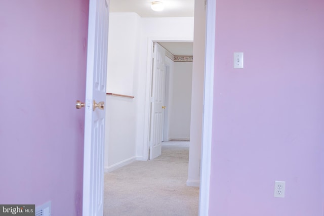 corridor with light carpet