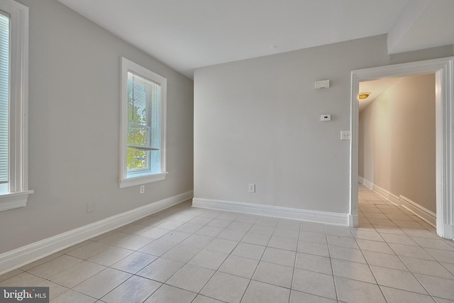 empty room with light tile patterned flooring