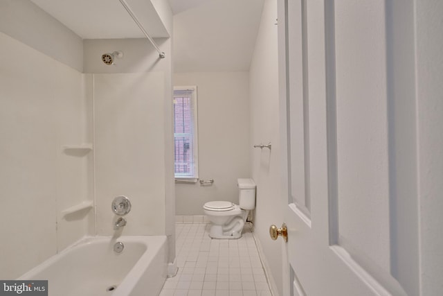 bathroom featuring tile patterned flooring, shower / bath combination, and toilet