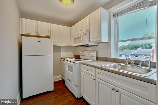 kitchen with dark wood-type flooring, sink, white cabinets, decorative backsplash, and white appliances