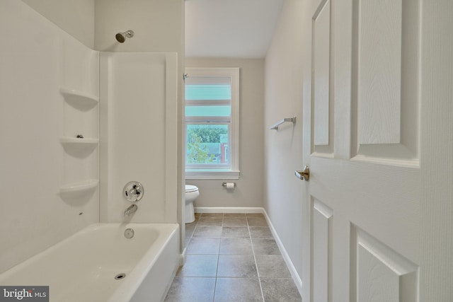 bathroom with tile patterned flooring, shower / tub combination, and toilet