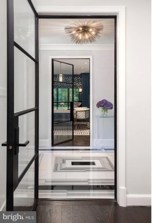 doorway to outside with french doors and hardwood / wood-style floors