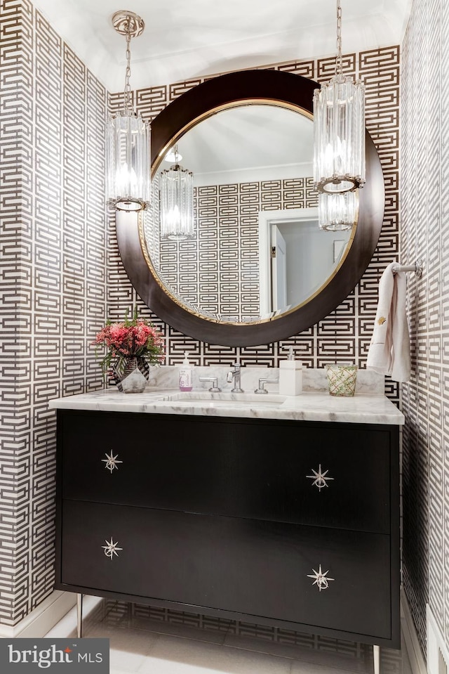 bathroom with vanity and a notable chandelier