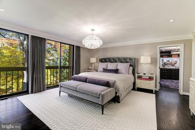 bedroom featuring hardwood / wood-style floors, a chandelier, ornamental molding, and multiple windows