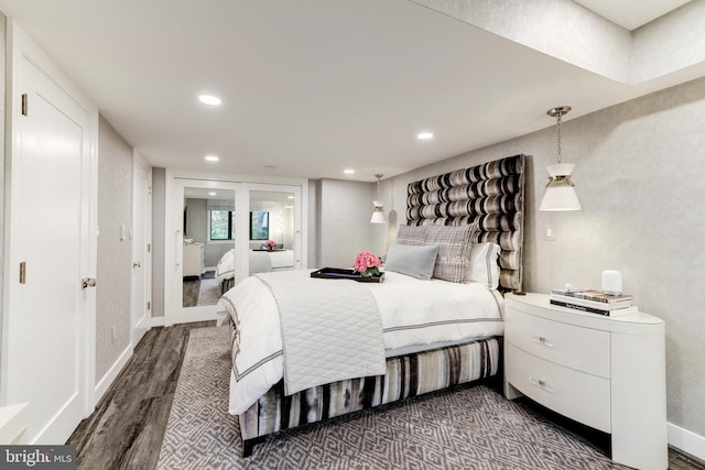 bedroom featuring dark hardwood / wood-style flooring