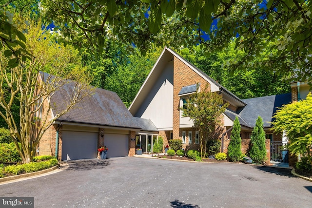 714 Belgrove Rd, Mclean, VA 22101 - view of front of property with brick siding, a garage, and driveway