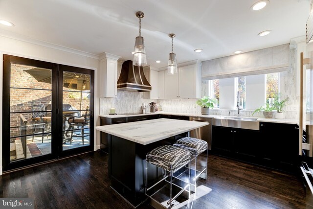 714 Belgrove Rd, Mclean, VA 22101 - kitchen with custom exhaust hood, a sink, a kitchen island, dark wood-style floors, and recessed lighting