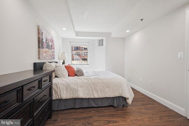 bedroom with dark wood-type flooring