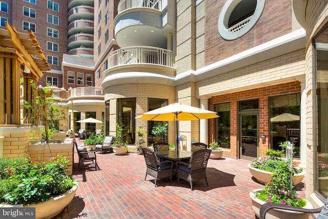 view of patio featuring a balcony