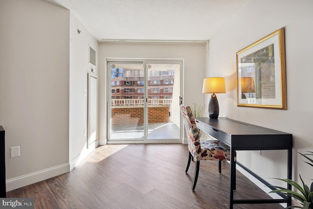 office with a textured ceiling and hardwood / wood-style flooring