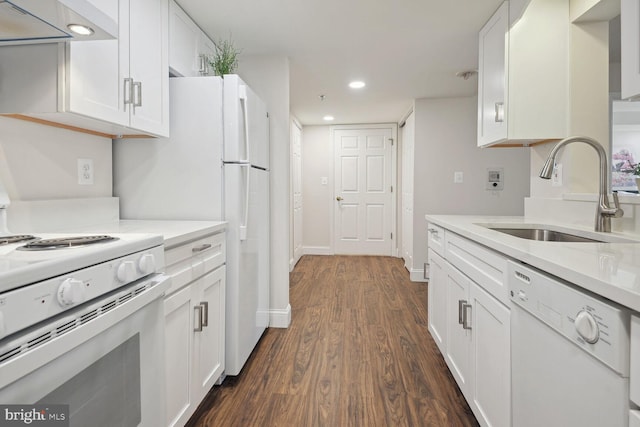 kitchen featuring white appliances, white cabinetry, extractor fan, and sink