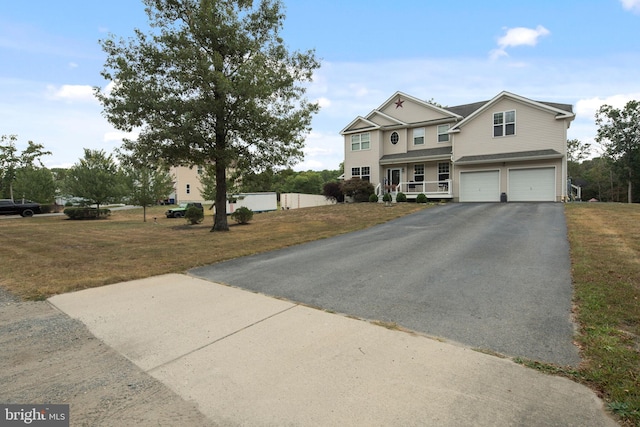 view of front facade with a garage and a front lawn