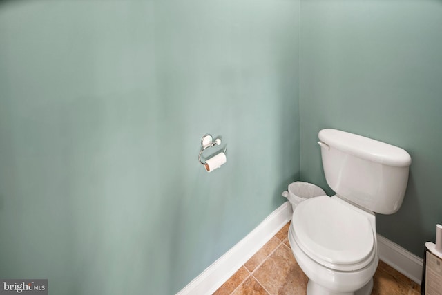 bathroom with tile patterned floors and toilet