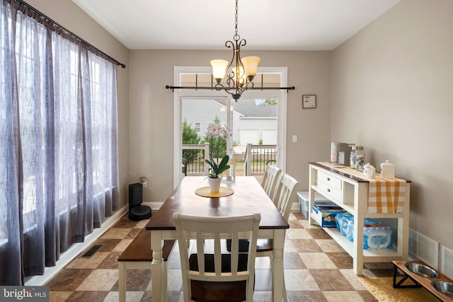 dining area with a notable chandelier