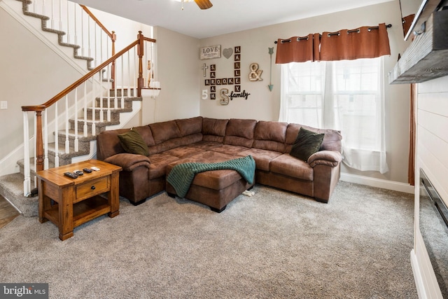 carpeted living room with ceiling fan