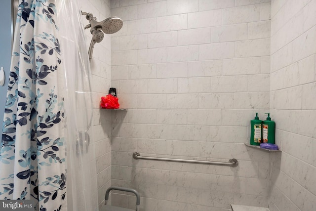 bathroom with a shower with curtain