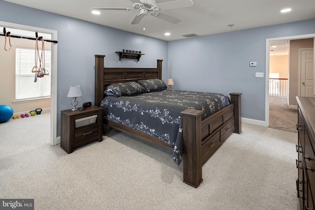 bedroom with light colored carpet and ceiling fan